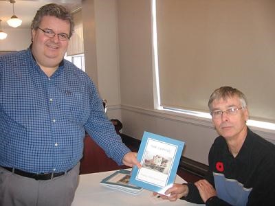 Rogers Radio General Manager Peter McKeown gets his copy