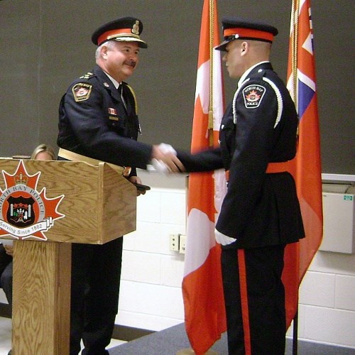 Police Chief Paul Cook welcomes Cadet Steven Carleton to the North Bay Police Service