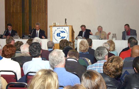 <b>Green Party candidate Meg Purdy makes a point at Wednesday night's chamber of commerce debate. (L-R) Nipissing-Temiskaming MP Anthony Rota, Conservative Party candidate Peter Chirico, debate moderator Dennis Mock, and NDP candidate Dave Fluri. Photo By Bill Tremblay, Special to BayToday.ca.</b>