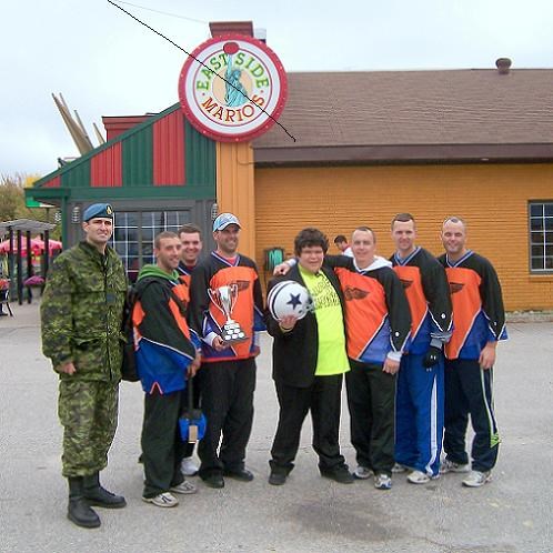 Tournament Champions, The Jaegerbombers, from 51 Squadron at 22 Wing/Canadian Forces Base North Bay, are shown here, from left to right, Major Mark Roberts, Cpl Cory Fagan, Capt Marc La Haye, Cpl Trevor Williamson (Captain), Easter Seals youth Cory Potter, Cpl Darryl Fitzpatrick, Cpl Jamie Fitzpatrick and Cpl Jeff Ryan.