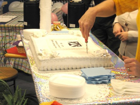 Cutting the cake. Photo by Shane Lighter, Special to BayToday.ca.