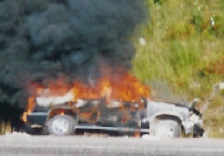 North Bay resident Ken Ferance will be receiving a Governor General's certificate of appreciation for pulling a Sault Ste. Marie-area woman from this burning car just north of the Soo. Photo by Ken Ferance.