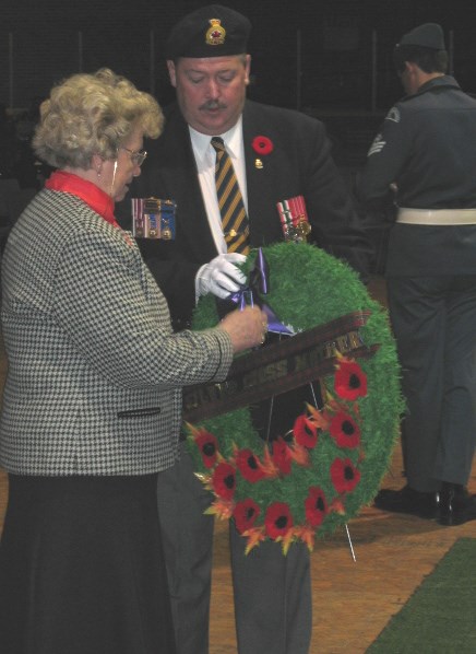Dorothy Kenney lays a wreath in honour of her brother Ron McLean, who died June 30, 1943, in France. Kenney represented Silver Cross mothers in the North Bay area at a Remembrance Day service Tuesday at Memorial Gardens.