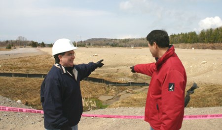 Brian Bertrand, lead architect of the project, helps Anthony Rota visualize what the hospital will look like.