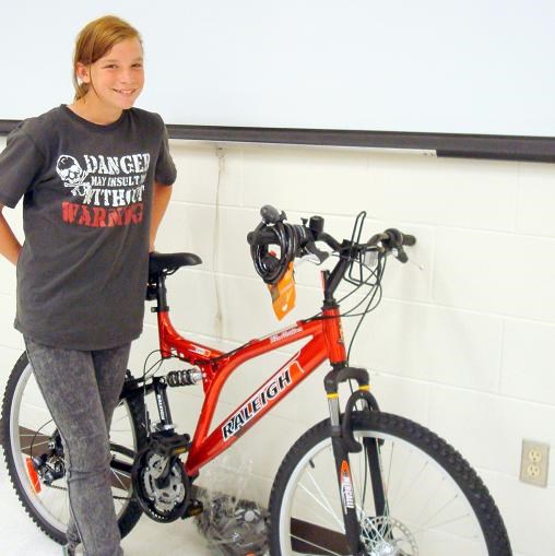 Kayla Larochelle is all smiles with her new bike