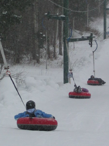 Tubers are pulled back up the hill at the Canadian Tire Tube Park.