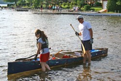 Brittny Labrecque (L) and Scott Hendry prepare their canoe for the race.
