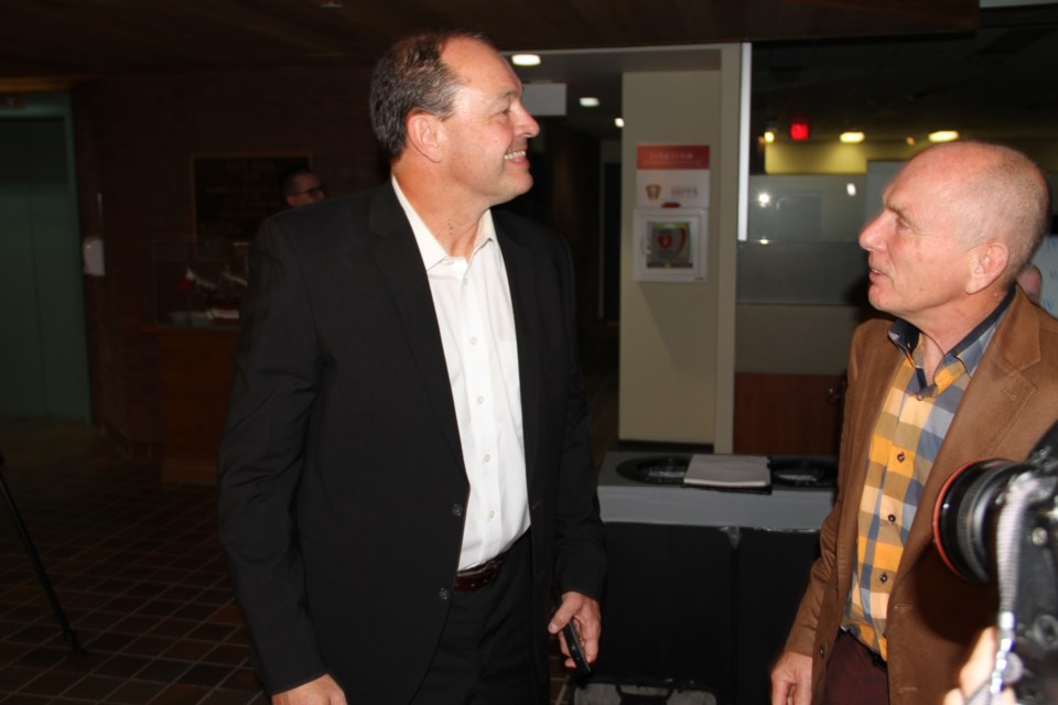 Al McDonald speaks with Gary Gardiner.  Photo by Chris Dawson/BayToday.ca 