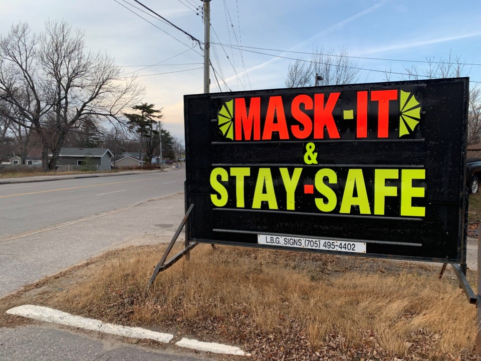20201119 covid mask it and stay safe sign 2 turl stock