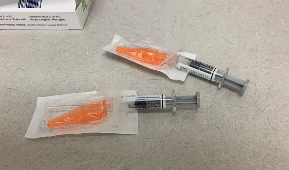 20211019 flu vaccine needles turl