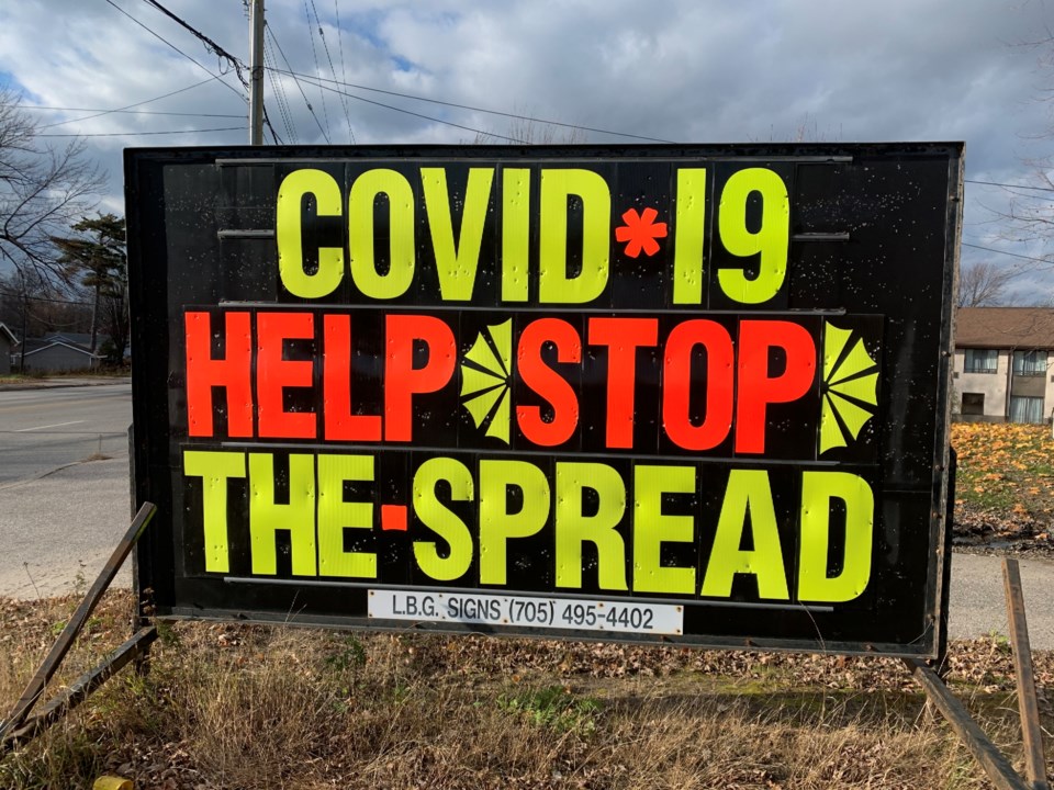 20211111 covid sign stop the spread turl