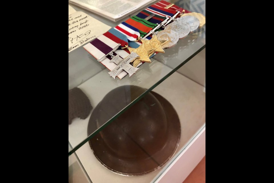 Photo of Sunstrum's helmet and medals at the North Bay Museum