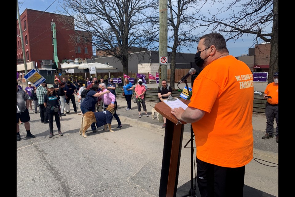 Henri Giroux addresses the crowd on Wyld Street.  Photo by Chris Dawson/BayToday. 