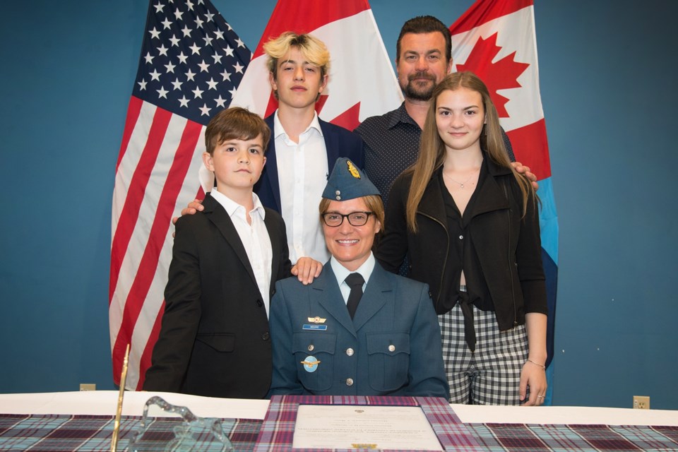 Corina Moore's family.  Jordon, Madison In back: Tyler, Corina, and her husband Jay.
 Image by: Cpl Rob Ouellette                                  22 Wing North Bay, North Bay ON                                                                                                                   Â© 2020 DND-MDN Canada