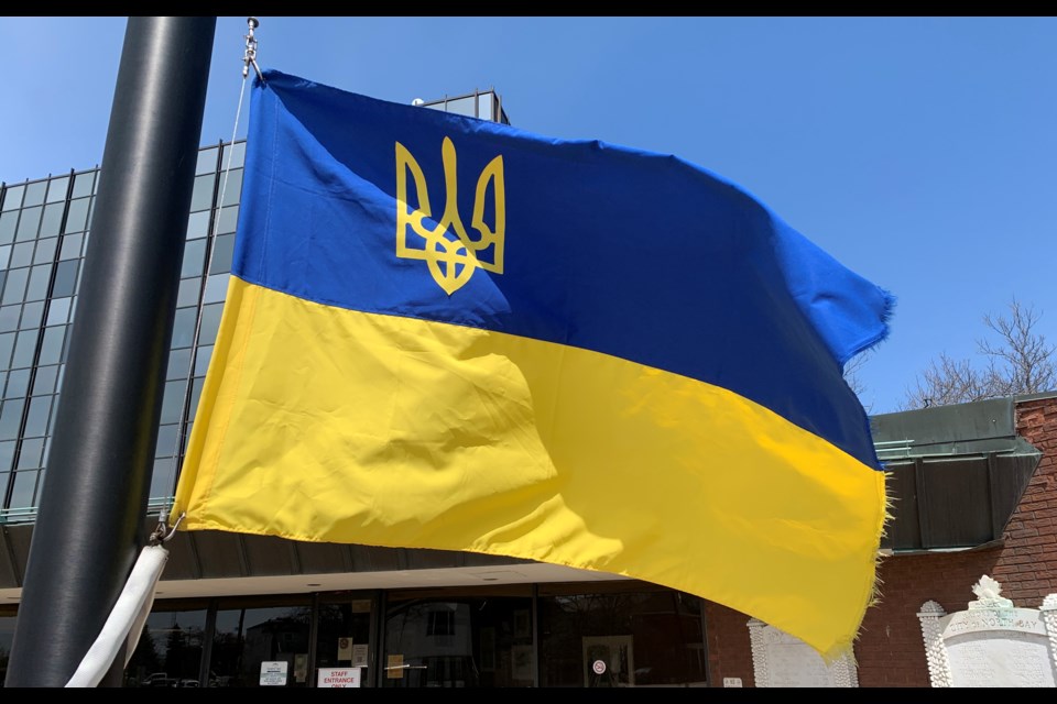 A Ukrainian flag flies outside North Bay's City Hall.