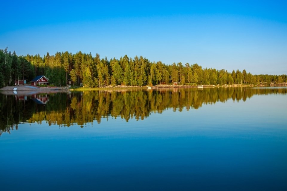 cottage on lake shutterstock_219892363