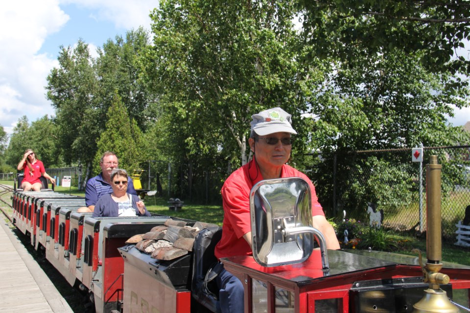 USED 170803 10 Tom and Mary Verstick of Amherstburg enjoy a mini train ride. Photo by Brenda Turl for BayToday.