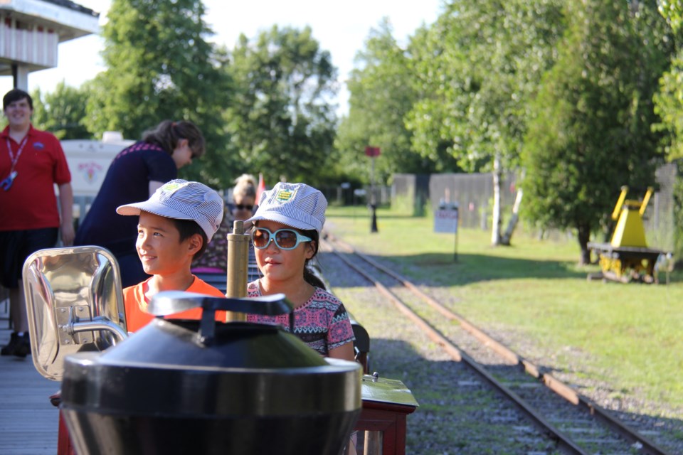 USED 170706 3 Henry and Joyce Deng of Gatineau, Quebec enjoy a ride aboard the Heritage Railway. Photo by Brenda Turl for BayToday
