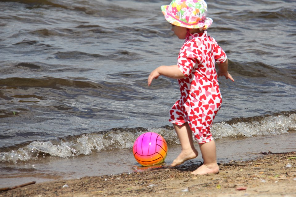 USED 170713 1 Charlotte Toye, 18 months, plays soccer on the beach.Photo by Brenda Turl for BayToday.