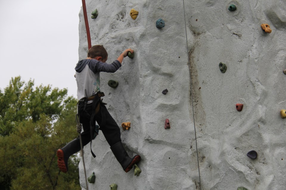 USED 170908 10 Zachary Roy,7 tries his hand at rock climbing, Photo by Brenda Turl for BayToday.