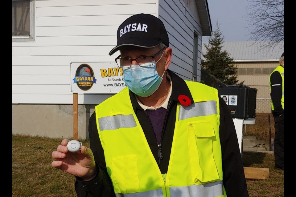 BAYSAR's Stan French shows off a Project Lifesaver transmitter. Photo: Stu Campaigne