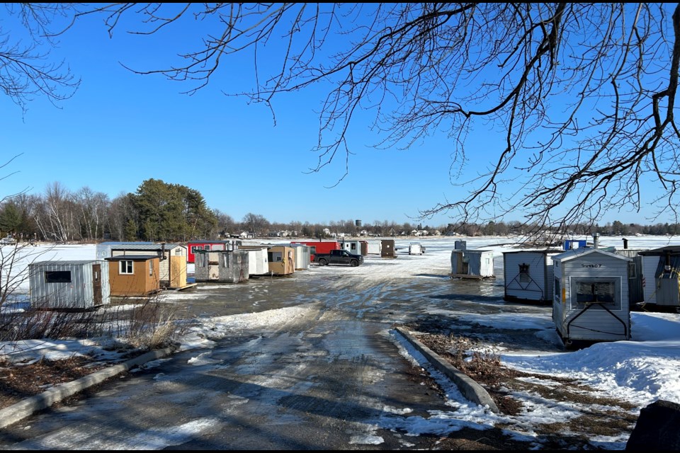 Ice Huts lined up along Sunset Park Friday afternoon waiting for removal.