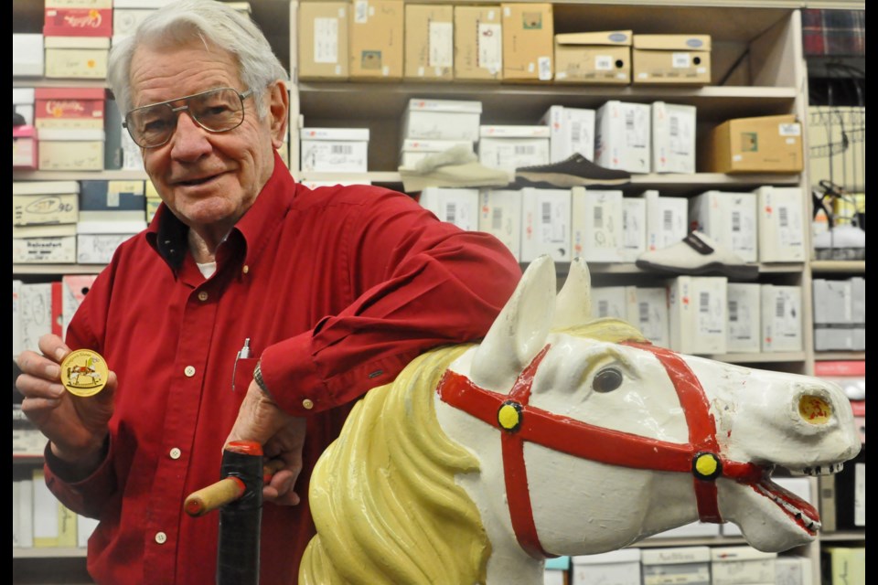 Deegan's struck a coin to celebrate its 125th business anniversary, Ralph Diegel shows off the coin.