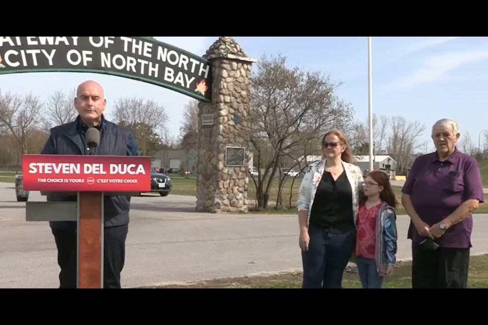 Liberal leader Steven Del Duca announces the party's northern platform, flanked by Nipissing candidate Tanya Vrebosch and her step-daughter Sydney, and Tanya's father Bill Vrebosch.