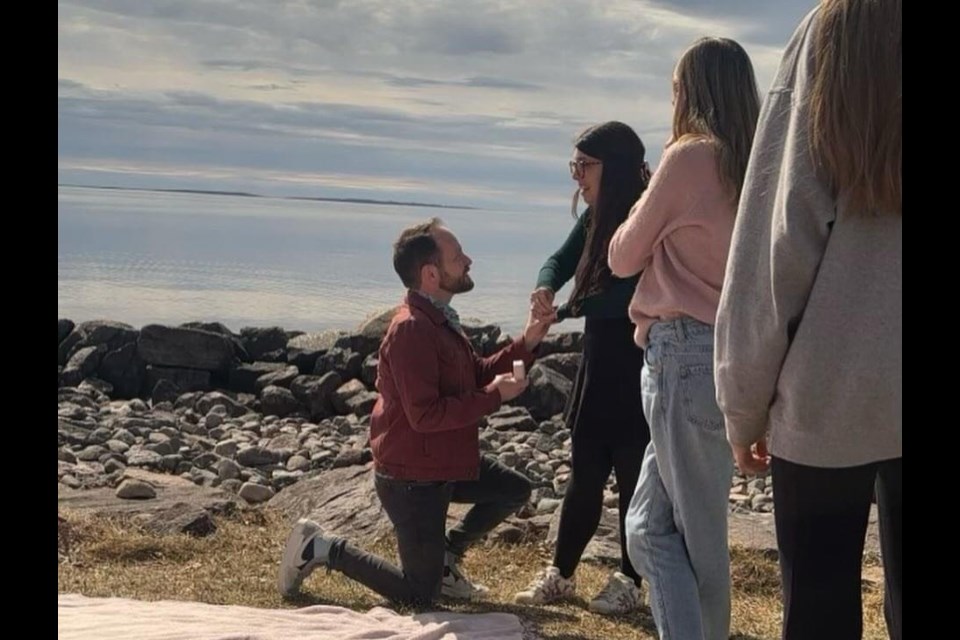 Love under the eclipse. Australian Scott Strange pops the question to Callander's Robin Benard at the height of Monday's eclipse.