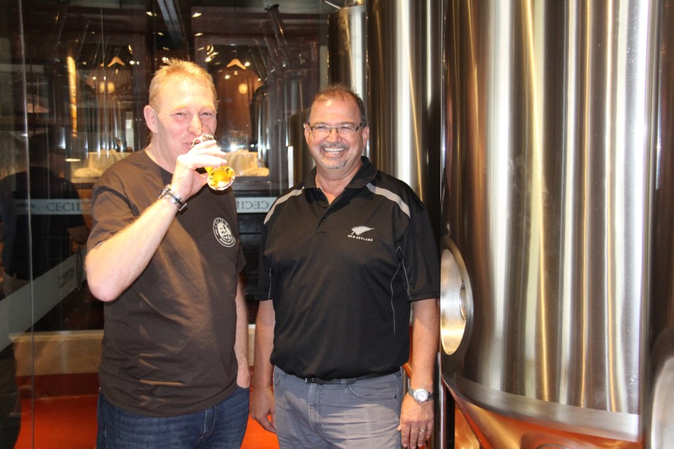 Brew master Brian Watson and Cecil's owner John Lechlitner sample their beer. Photo by Jeff Turl