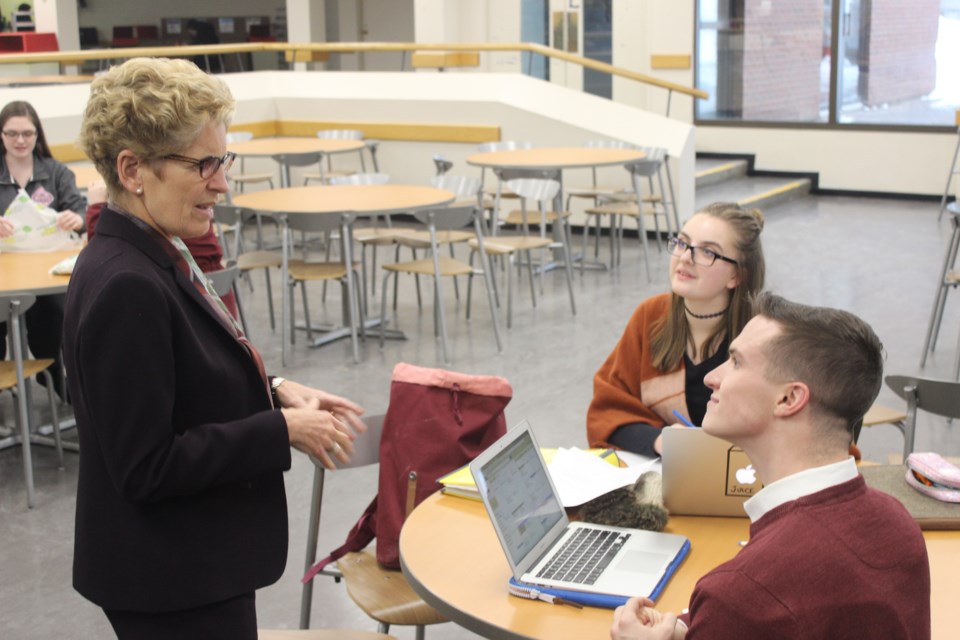 Premier Kathleen Wynne speaks with students during a tour of Canadore College. Ohoto by Ryen Veldhuis.