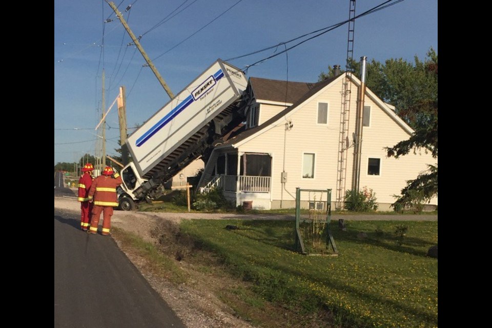 The truck hit this house in Alban. Courtesy OPP.