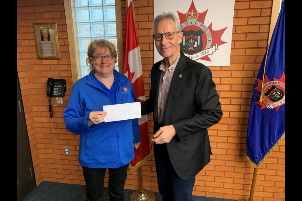 North Bay Mayor and Police Board member Peter Chirico with a cheque for Major Stephanie Watkinson, Salvation Army of North Bay.  Photo by Chris Dawson/BayToday. 