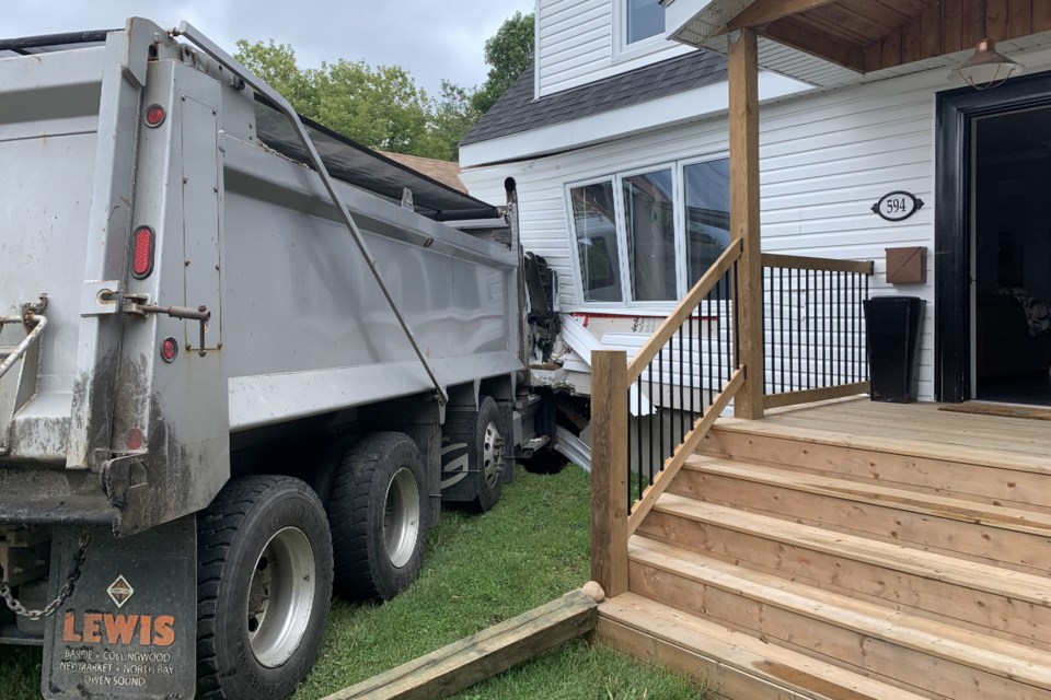 No injuries as this dump truck slammed into an unoccupied house on Nipissing St.