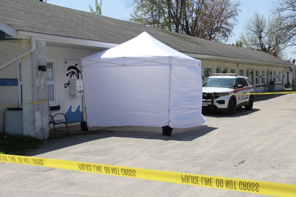 A tent has been erected outside the scene of the investigation by the Forensics Unit.