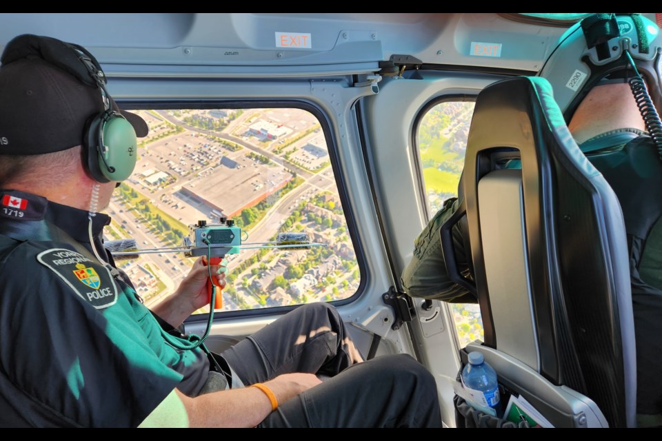 An officer with the York Regional Police training in Project Lifesaver