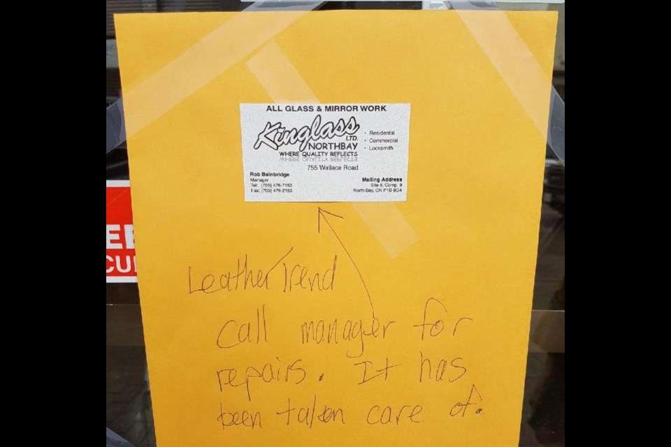 A note on the front door of Leather Trend from Kinglass says the company will cover the damages. Submitted photo.