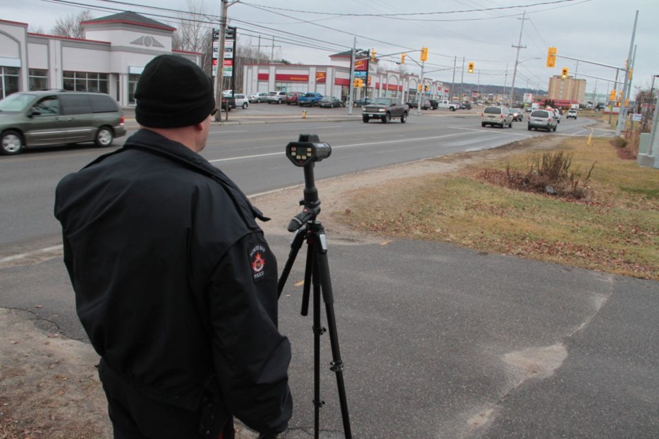 Constable Ken Ayres targets speeders on McKeown Avenue on Thursday, December 10th.  Photo by Chris Dawson. 
