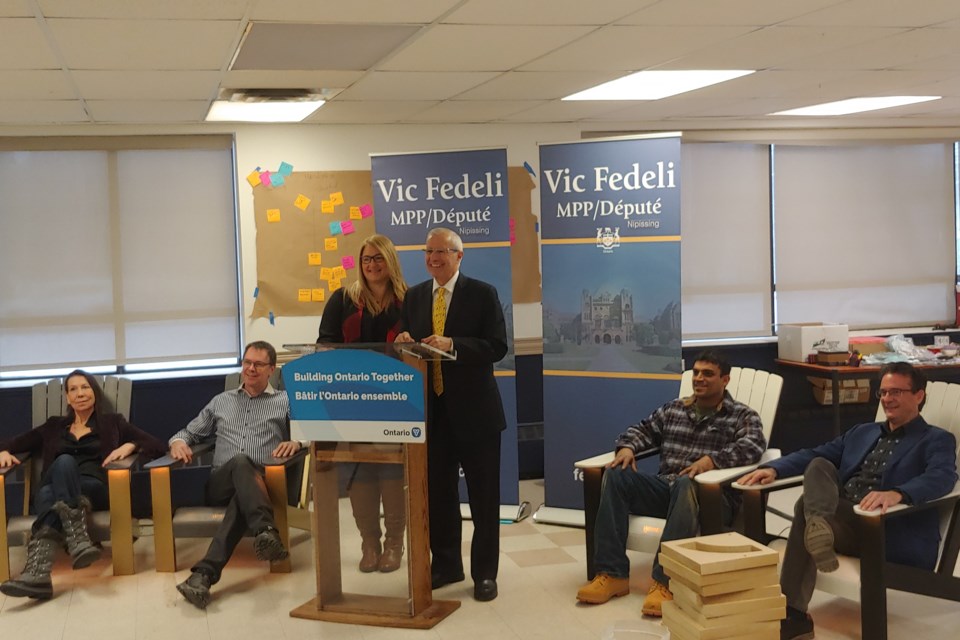 (L-R) Sally Daub and John Pomeroy of Wrmth, Laurie Marcil of NOHFC, MPP Vic Fedeli, Andrew Naylor, general manager of operations of Cuna Railway, and Mark Sherry of One Red Maple.