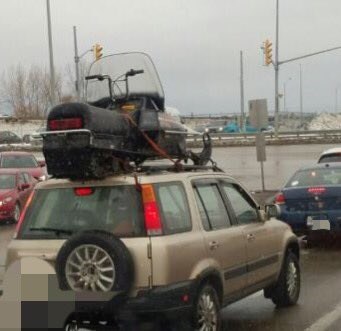 Definitely a dangerous way to transport your sled. Courtesy OPP.
