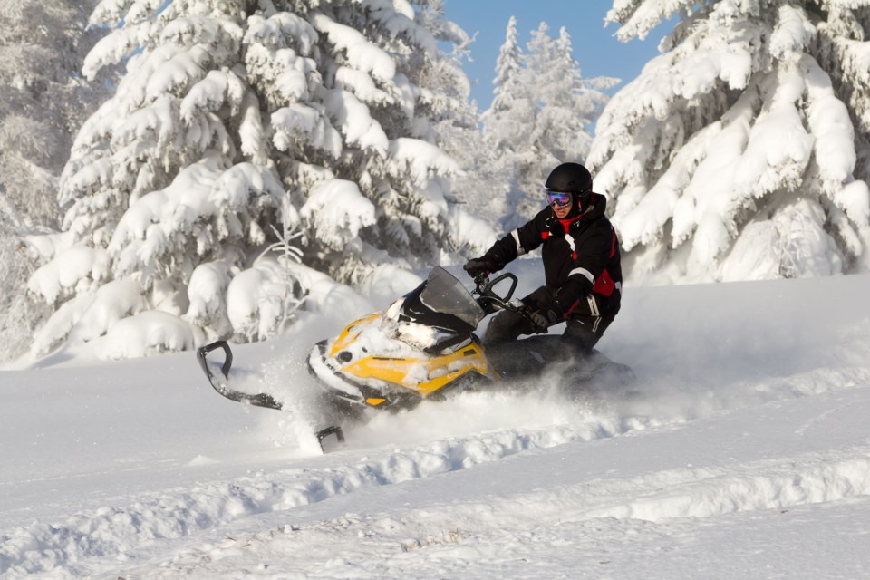 snowmobile in deep powder AdobeStock_75981339 2017