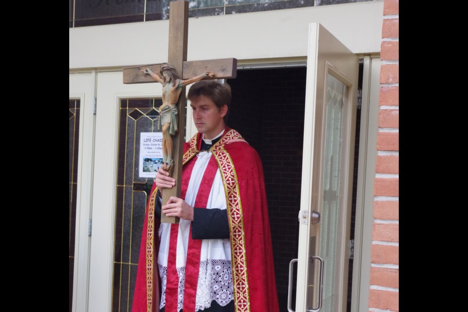 The Feast of the Exaltation of the Holy Cross. Father Eric Mason. Courtesy Kathie Hogan.