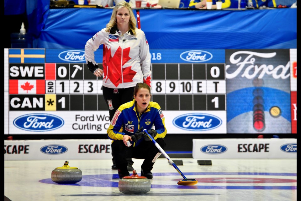 Canadian skip Jennifer Jones watches intently as Swedish skip Anna Hasselborg directs her sweepers. Tom Martineau/BayToday.