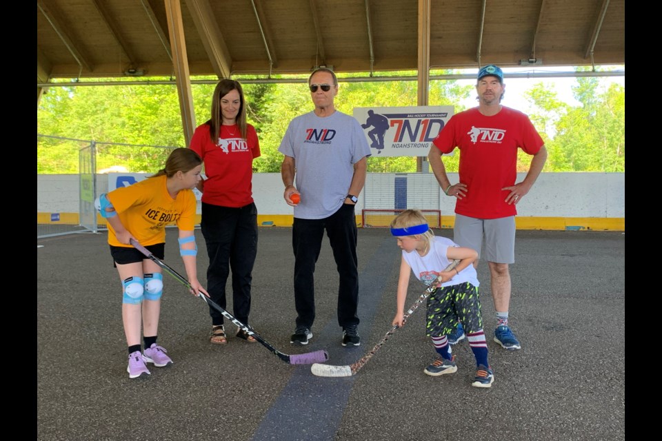 Bill Barber alongside Jody and Dave Dugas prepare for the ceremonial faceoff with Wyatt Coughlin and Abigail Dugas.  Photo by Chris Dawson/BayToday. 