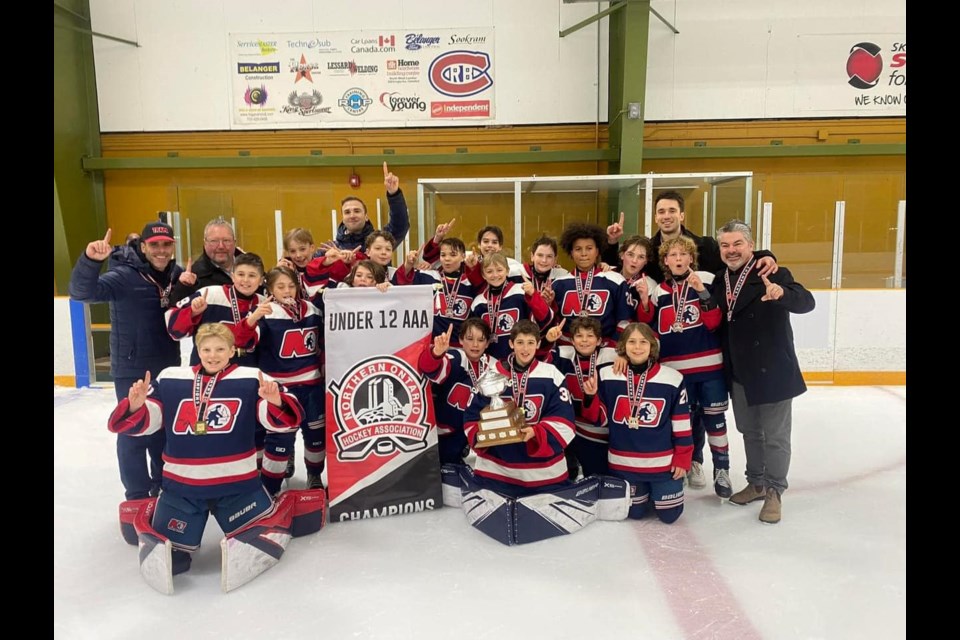 U12 AAA Trappers celebrate an NOHA title. 