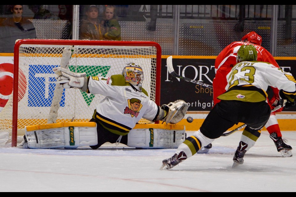Soo Greyhounds forward Keeghan Howdeshell is stopped by North Bay Battalion goaltender Julian Sime in OHL action Friday night in North Bay. Tom Martineau for Village Media