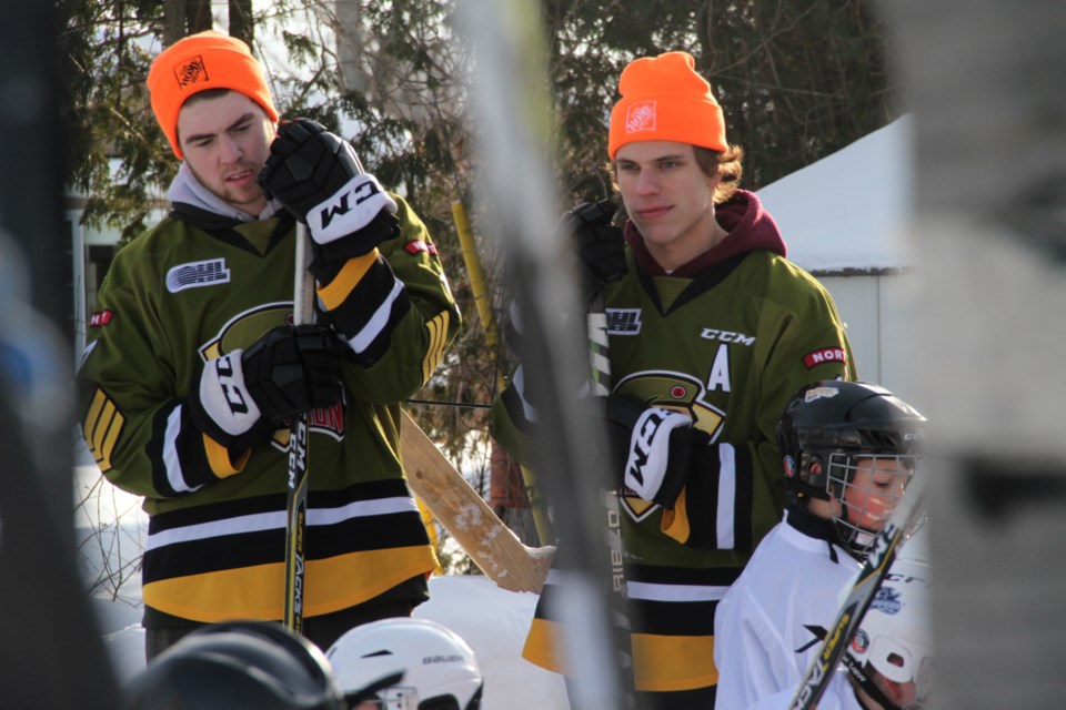 Linemates Justin Brazeau and Matt Struthers watch some ODR excitement.  Photo by Chris Dawson/BayToday.ca. 