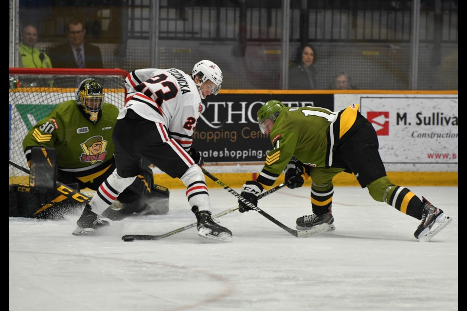 Battalion goalie Christian Purboo tracks the puck down low.  Photo by Tom Martineau/BayToday.ca. 