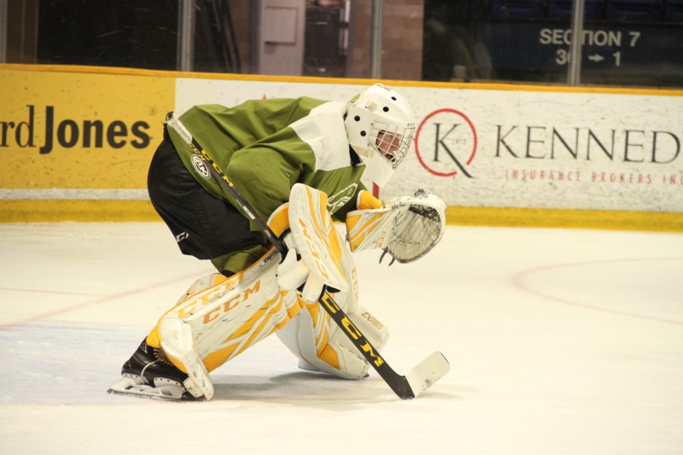 Joe Vrbetic prepares for a breakaway by Liam Arnsby during action Saturday night.  Photo by Chris Dawson/BayToday. 