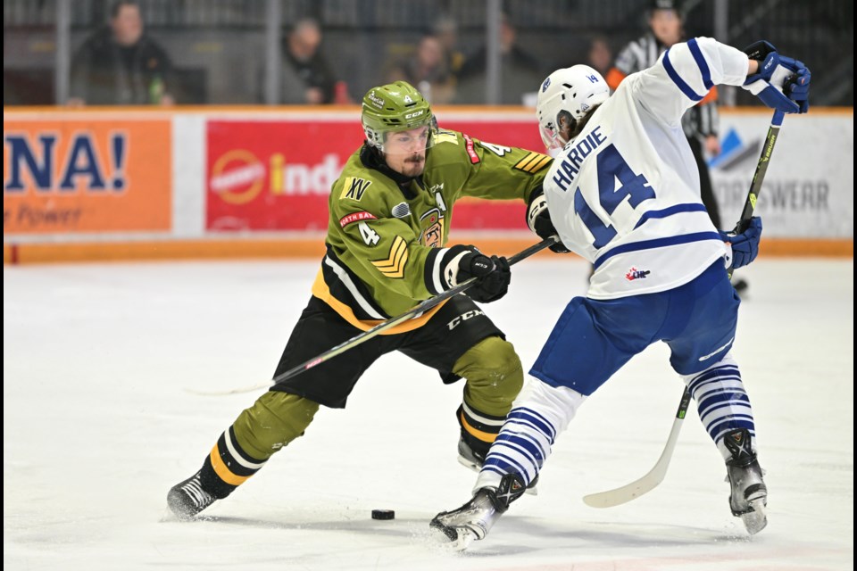 Paul Christopoulos tries to defend. Photo by Tom Martineau/BayToday. 